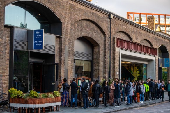 Diners queue outside Indian restaurant Dishoom at Granary Square in the King’s Cross district of London.