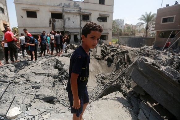 A boy inspects the rubble of a residential building destroyed by an Israeli air strike in Gaza City on Saturday.