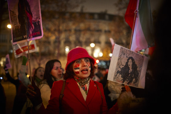 People demonstrate outside the Iranian embassy in Paris against the execution of Mohsen Shekari in Iran on December 08.