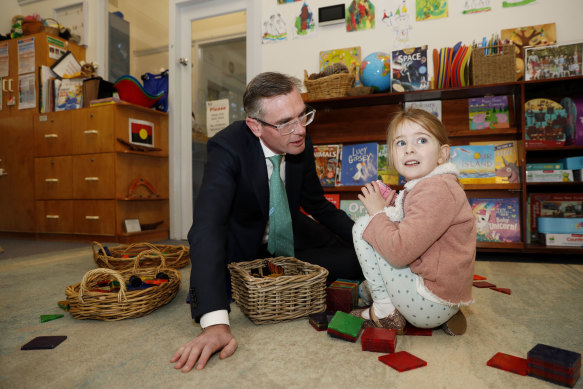 NSW Premier Dominic Perrottet has committed to implementing another year of play-based learning within the public school system. He is pictured here with his daughter Harriet at Cheltenham Memorial Preschool.