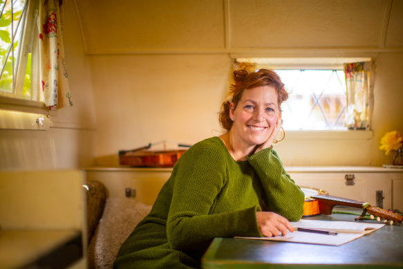 Jenny Thomas inside her retro caravan.  ''I’m very interested in how long a culture can endure within people.''