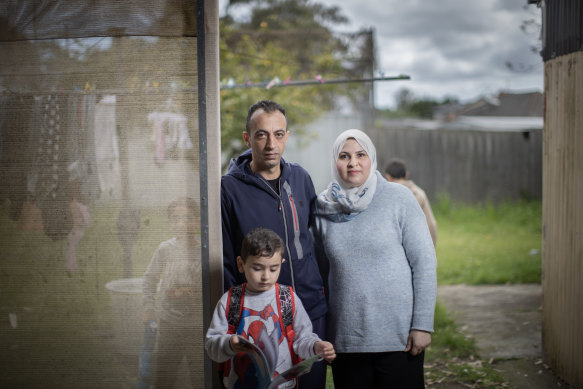 Ali and Smaher Alalawi and their three sons in their Melbourne backyard.