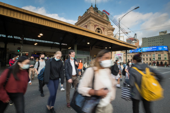 Workers returning to the Melbourne CBD at Flinders Street Station earlier this month.
