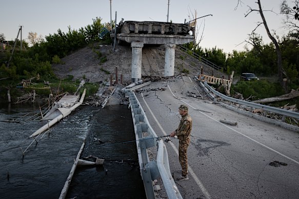 A National Guard soldier fishing in the Donets River on a day off from the front line.