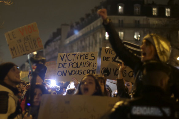 Women's rights activists protest near Friday's Cesar ceremony in Paris because Roman Polanski's latest film led the nominations.