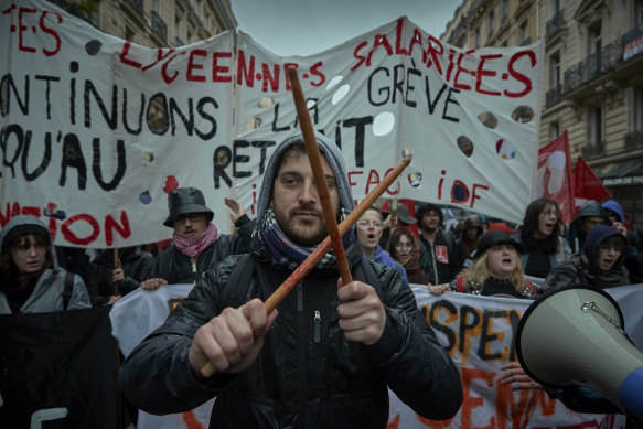 Protesters chant and demonstrate through central Paris against the French Government’s Pension Law ahead of the decision by the constitutional council on Friday.