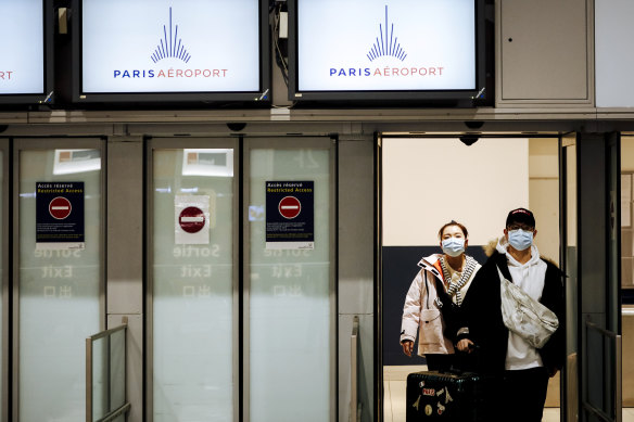 Travellers from Beijing arrive at Charles de Gaulle Airport in Paris prior to the suspension of flight from China in January.