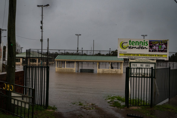 Tennis courts affected by floodwaters in Camden in Sydney’s west.