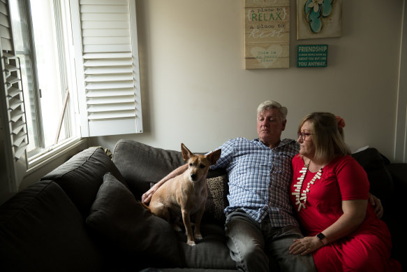 Former Roosters player John Higgins with his wife Simone and their dog Casper.