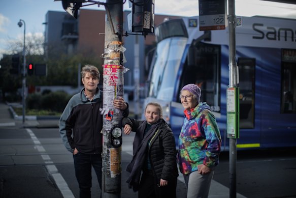 Matthew Wright (far left) is leading a push to make public transport permanently free in Victoria, with help from his niece Maya Wright (middle) and fellow campaigners like Andrea Bunting.