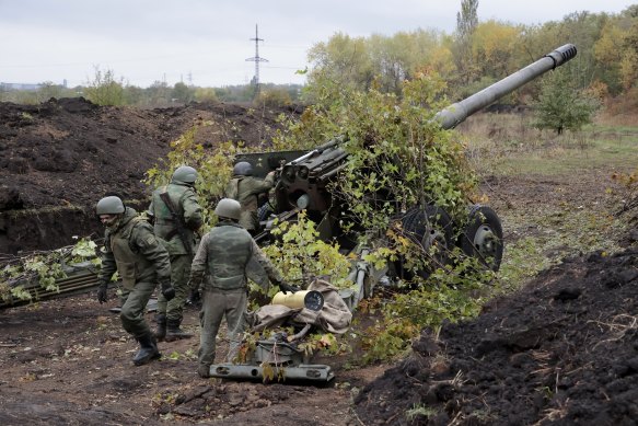 Russian soldiers prepare to fire their howitzer from their position at Ukrainian troops at an undisclosed location in Donetsk People’s Republic, eastern Ukraine.