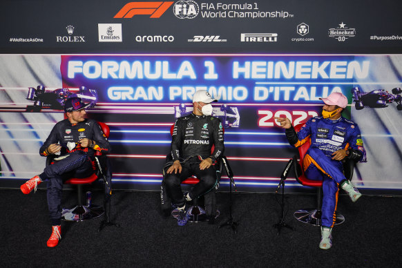 Max Verstappen, Valtteri Bottas and Daniel Ricciardo talk during a press conference. 