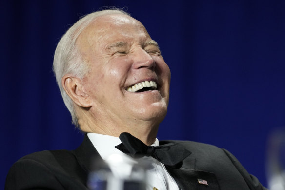 President Joe Biden laughs as comedian Roy Wood jnr speaks during the White House Correspondents’ Association dinner. 