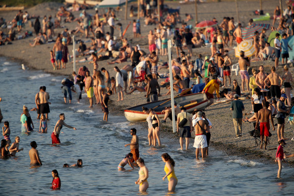 Beachgoers on Kitsilano Beach during a heatwave in Vancouver, British Columbia, Canada, on Monday, June 28, 2021. 