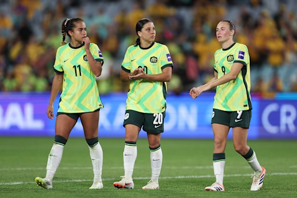 Mary Fowler, Sam Kerr and Caitlin Foord process the 3-3 draw.