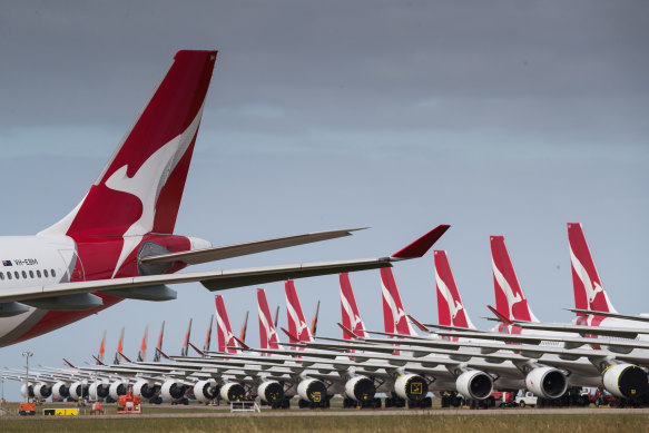 Qantas planes lined up for storage at Avalon Airport. Most of Qantas' and Virgin's jets are grounded, but business could pick up as travel bans lift. 