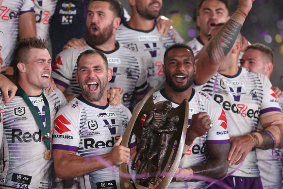 Cameron Smith and the Melbourne Storm with the premiership trophy.