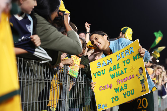 Sam Kerr poses with fans after the Matildas beat Thailand in Gosford last November.