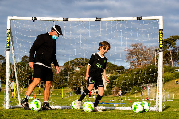 Henry Dale-Pope and coach Stuart Casey at Queens Park.