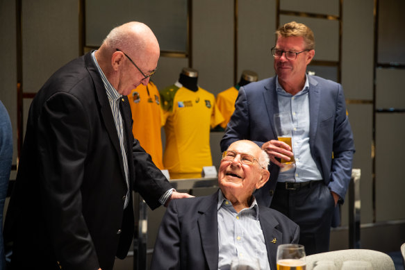 Eric Tweedale talking to Sir Peter Cosgrove and Nick Farr-Jones at a dinner to decide the Wallabies jersey colour in 2021.