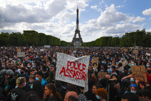  Demonstrators gather on the Champs de Mars in Paris.  
