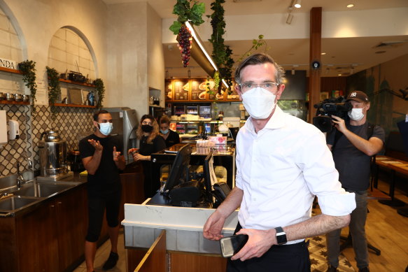 NSW Premier Dominic Perrottet visits a cafe at Casula Mall on Thursday.