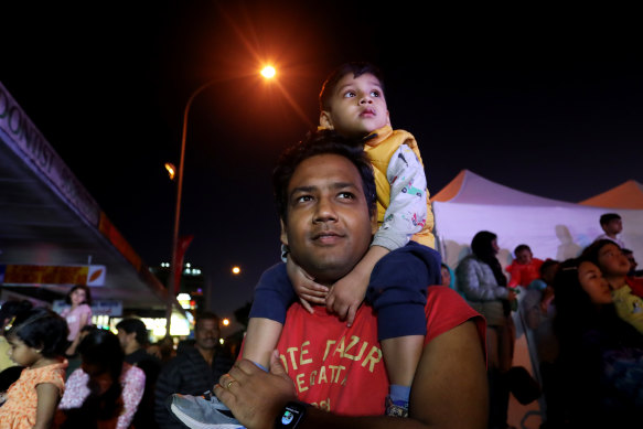 Father and son at a Diwali festival in Wentworthville in Sydney in 2022.