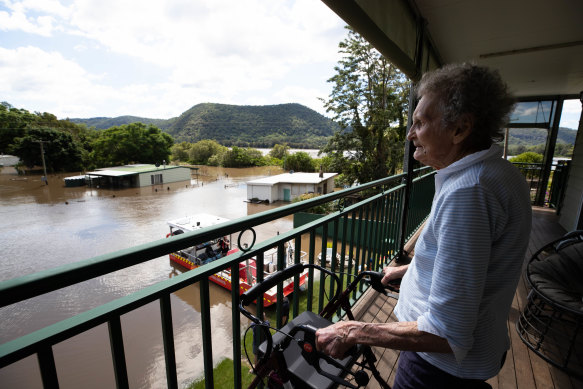 Patricia Parker views her submerged home from the safety of her son and daughter-in-law’s house during the 2021 floods.