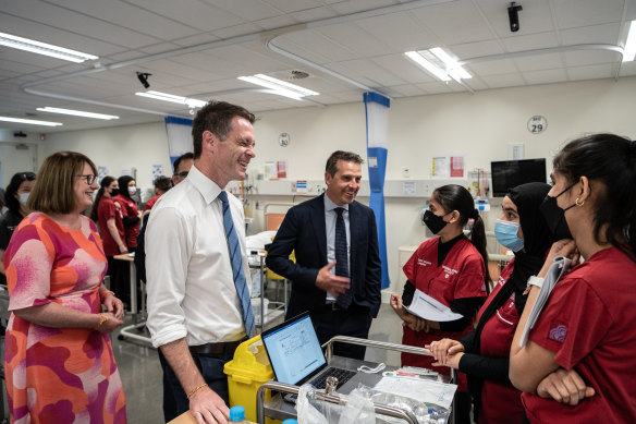 Ryan Park (centre) will be sworn in as the state’s new health minister. Attracting workers back to the NSW hospital system is his top priority.