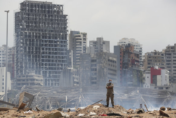 A soldier stands at the devastated site of the explosion in the Port of Beirut, Lebanon.