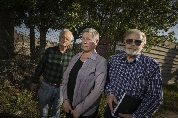 Residents Geoff Mitchelmore, Carmen Largaiolli and Bert Boere outside the site of the proposed soil cleaning plant in Brooklyn. 