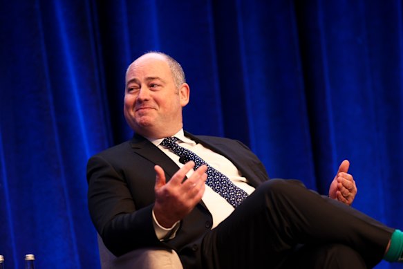 NAB chief executive Andrew Irvine says slashing staff will speed up decision-making and improve customer outcomes.  