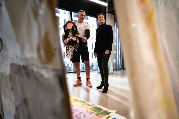 Sydney Lord Mayor Clover Moore, pictured with artist Neil McCann, said the city would turn into a “dead place” if its “creative spirits” could not afford to live and work in the inner city.