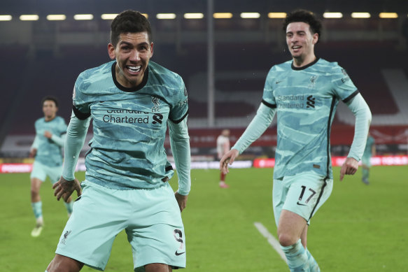 Roberto Firmino, whose goal was subsequently ruled a Sheffield United own goal, and Curtis Jones celebrate during Liverpool’s 2-0 Premier League win.