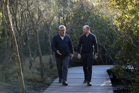 NSW Energy and Environment Minister, Matt Kean (right), with Deon van Rensburg, of the Greater Sydney Branch of the National Parks and Wildlife Service, in Bobbin Head, Ku-Ring-Gai National Park. 
