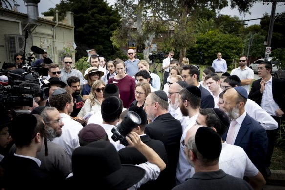 The premier surrounded by media and onlookers on Friday.