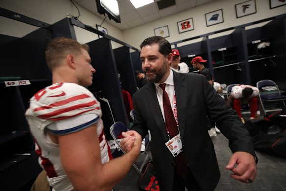 Jed York with San Francisco quarterback Christian McCaffrey last season. 