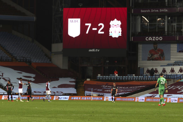 Players shake hands after Villa's drubbing of Liverpool.