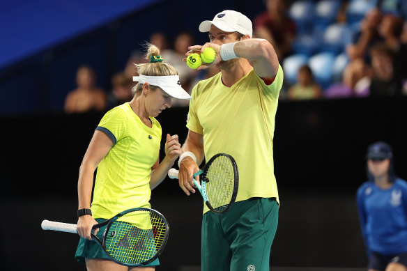 Storm Hunter and Matt Ebden of Team Australia talk in the mixed doubles match against Jessica Pegula and Rajeev Ram of Team USA during day four of the 2024 United Cup at RAC Arena. 