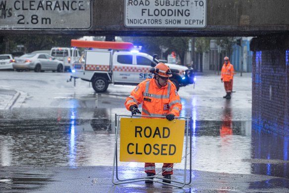 SES workers block the bridge at York Street. South Melbourne.