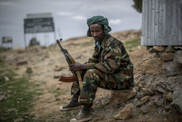 A fighter loyal to the Tigray People’s Liberation Front mans a guard post on the outskirts of the town of Hawzen, then-controlled by the group, in the Tigray region of northern Ethiopia in May.