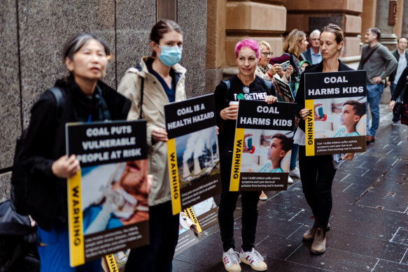 Dozens of public healthcare workers staged a demonstration in Sydney calling for investors to vote against the break-up of power giant AGL.