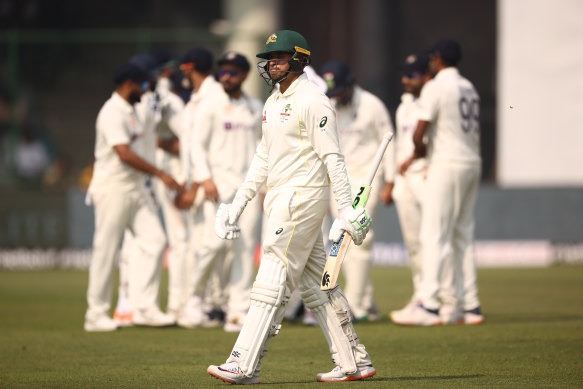 Usman Khawaja walks off after he was dismissed by Ravindra Jadeja in Delhi.