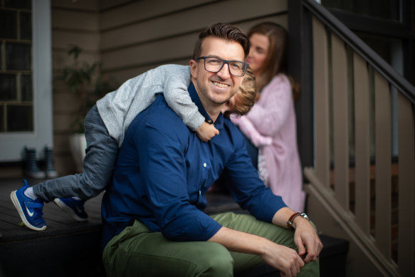 Glen Iris sales manager Phil Heys, with his son, Harry (and wife Kat and baby Rosie in the background). He hopes to keep doing some work from home after the pandemic passes.