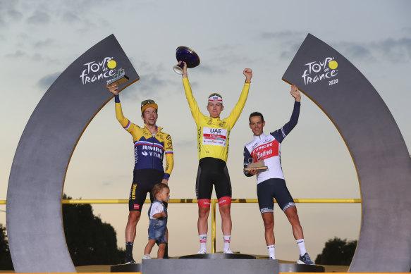 Richie Porte, right, on the Tour de France podium next to winner Tadej Pogacar, centre, and runner-up Primoz Roglic. 