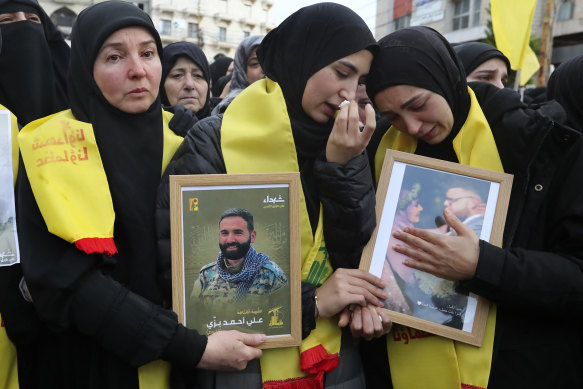 Mourners react during the funeral procession in Bint Jbeil, South Lebanon.