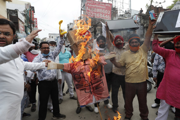 Indians in Lucknow burn an effigy of Chinese President Xi Jinping during a protest against the Chinese government on June 17 following clashes on the Himalayan border. 