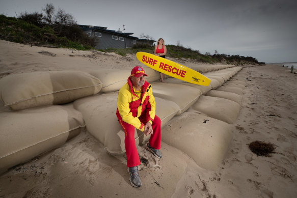 Inverloch Surf Lifesaving club President Warren Cook, pictured here with his daughter Jasmine. When the surf lifesaving club was built 10 years ago, it had no view of the sea but now the water is 30 metres from the door.