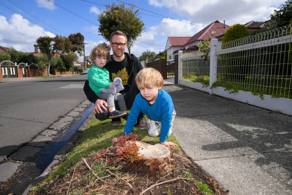 Jules Thomson-Martin with his children, Rufus and Wilco. Thomson-Martin was disappointed when the Merri-bek City Council cut down a tree on his street.