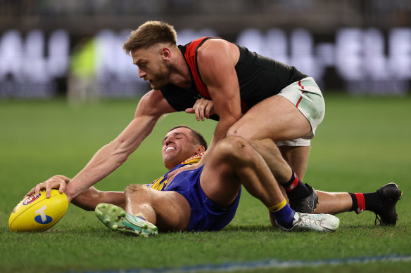 Jake Waterman of the Eagles and Jayden Laverde of the Bombers fight for the ball.